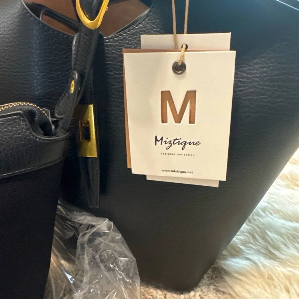 Miztique Black leather tote bag with gold hardware. Compartment bag.